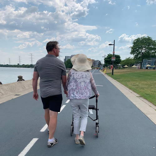Anna walking with Michael along the Burlington's lakefront