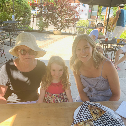 The ladies in the sunshine with pizza in Prince Edward County. 