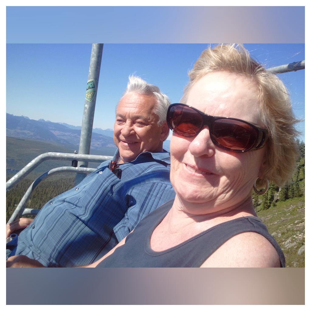 Riding the chair lift at Mt. Washington, Vancouver Island. Susan was terrified! But very brave. 